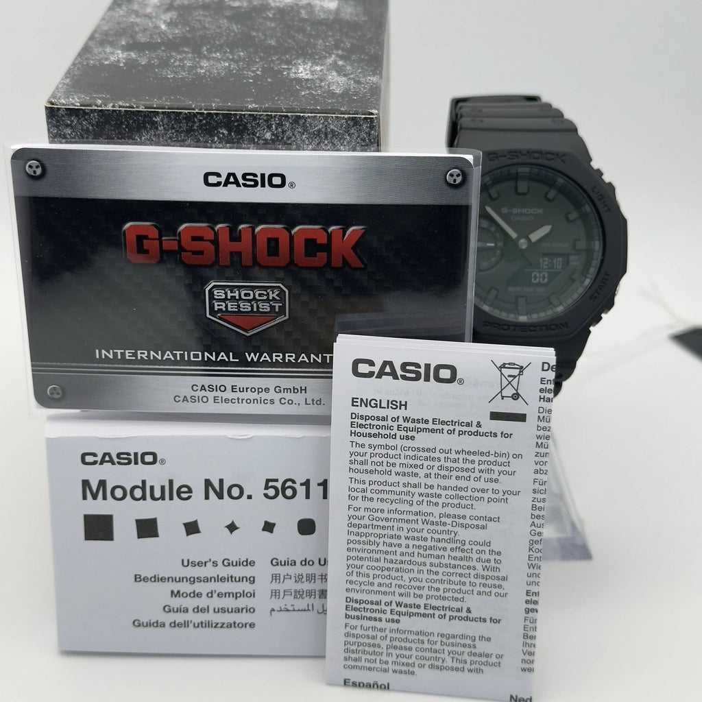 Casio G-Shock watch with packaging and manual on a white background