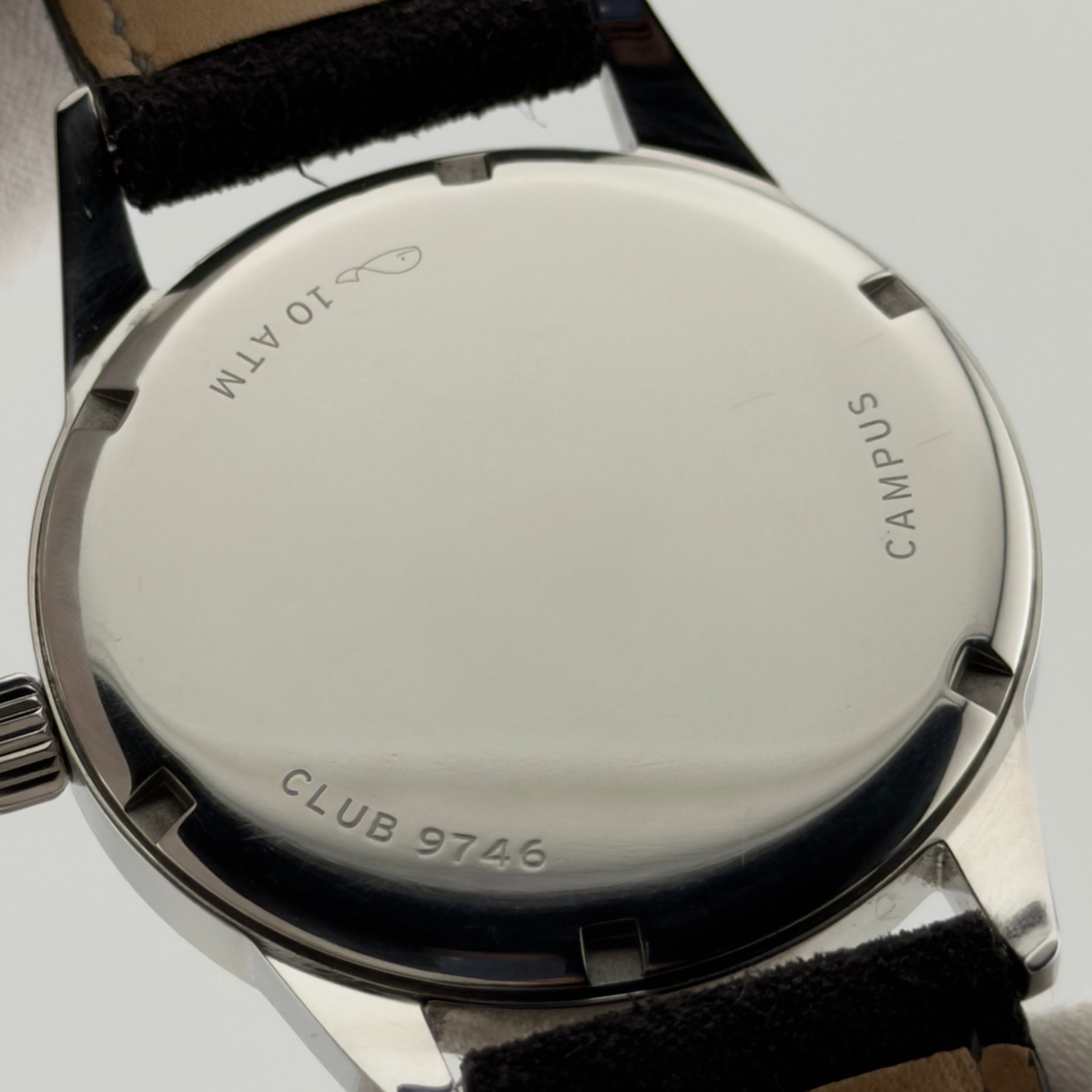 Back view of a watch with 'Campus' branding on a white background