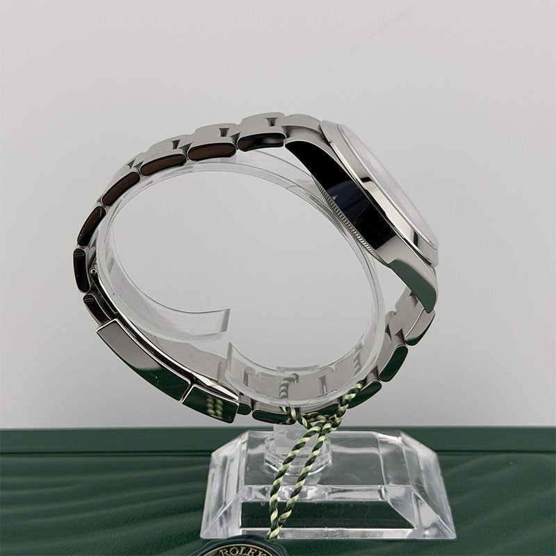 Rolex watch case on a stand with a white background