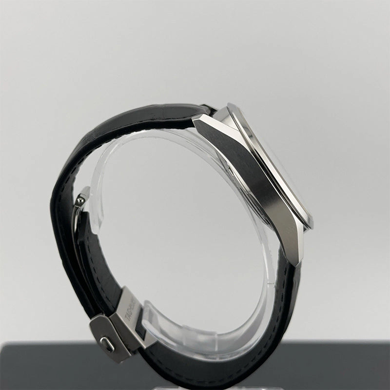watch with a black band and silver frame on a gray background